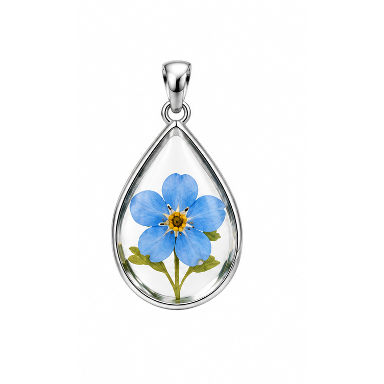 A Piece of Them blue forget-me-not teardrop memorial pendant with white gold frame and bail; illustrative render.