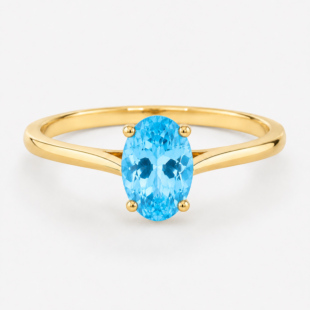 0.50 carat oval-cut blue topaz solitaire ring in 14K yellow gold