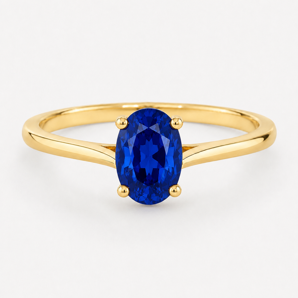 0.50 carat oval-cut laboratory-created blue sapphire solitaire ring in 14K yellow gold
