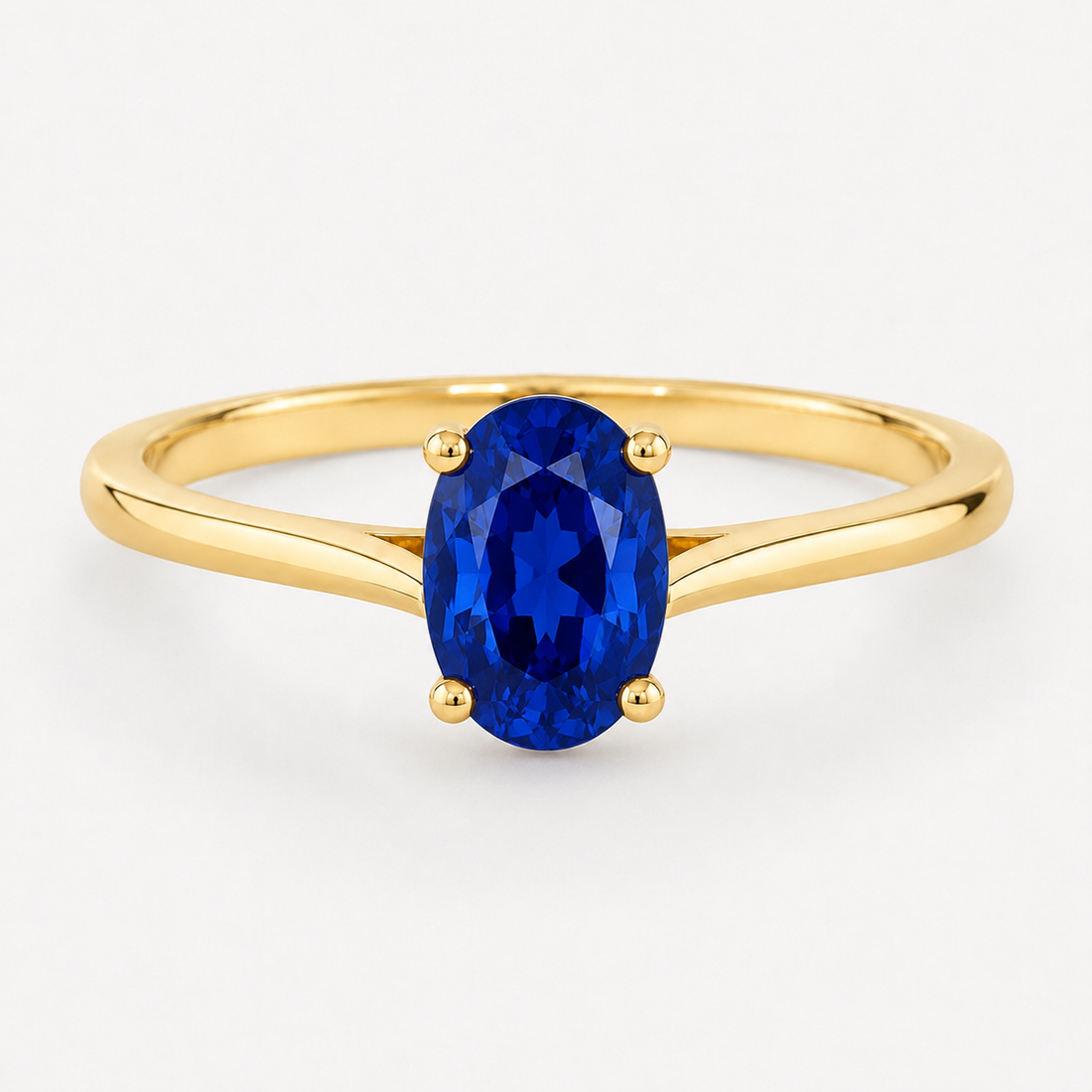 0.50 carat oval-cut laboratory-created blue sapphire solitaire ring in 14K yellow gold