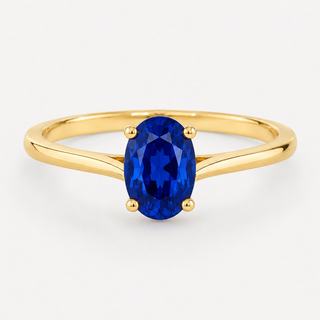0.50 carat oval-cut laboratory-created blue sapphire solitaire ring in 14K yellow gold