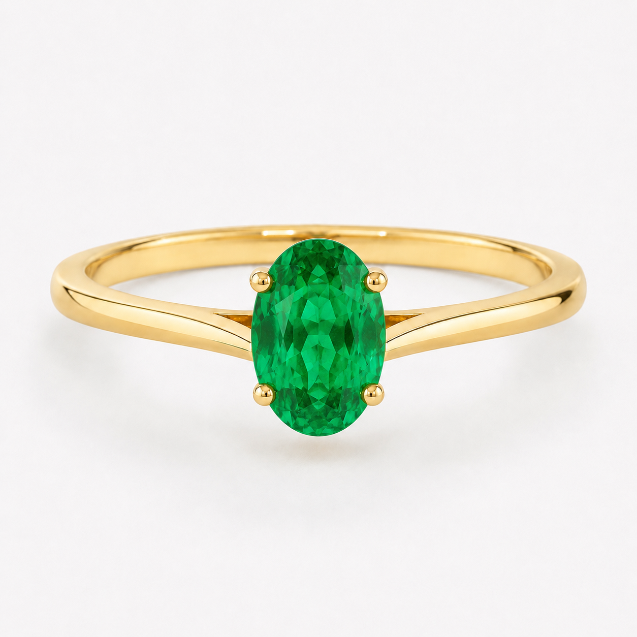 0.50 carat oval-cut laboratory-created emerald solitaire ring in 14K yellow gold