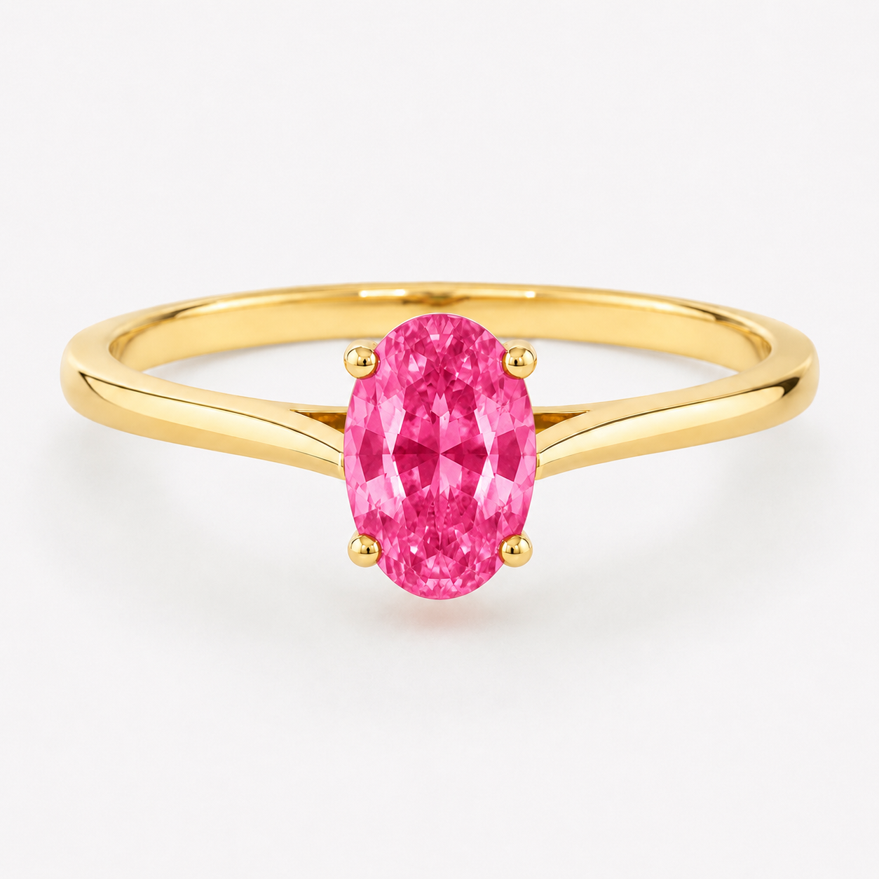 0.50 carat oval-cut laboratory-created pink sapphire solitaire ring in 14K yellow gold
