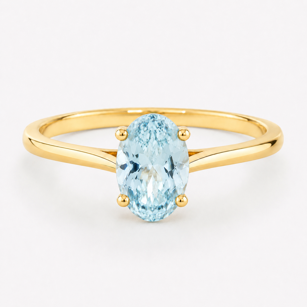 0.50 carat oval-cut natural aquamarine solitaire ring in 14K yellow gold
