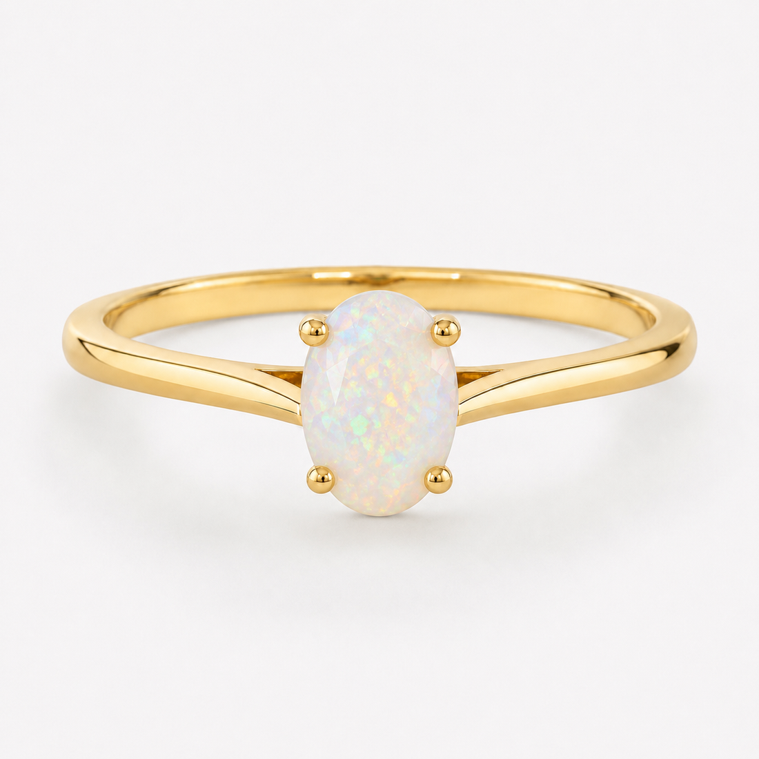 0.50 carat oval-shaped natural white opal solitaire ring in 14K yellow gold