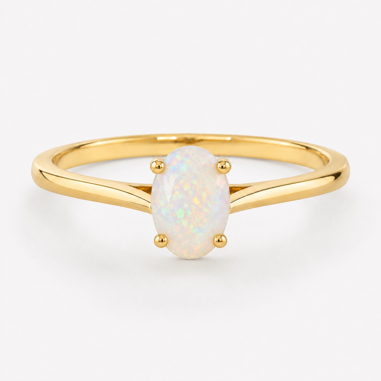 0.50 carat oval-shaped natural white opal solitaire ring in 14K yellow gold