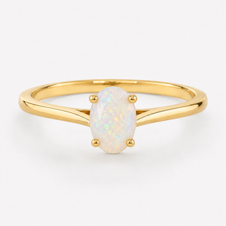 0.50 carat oval-shaped natural white opal solitaire ring in 14K yellow gold