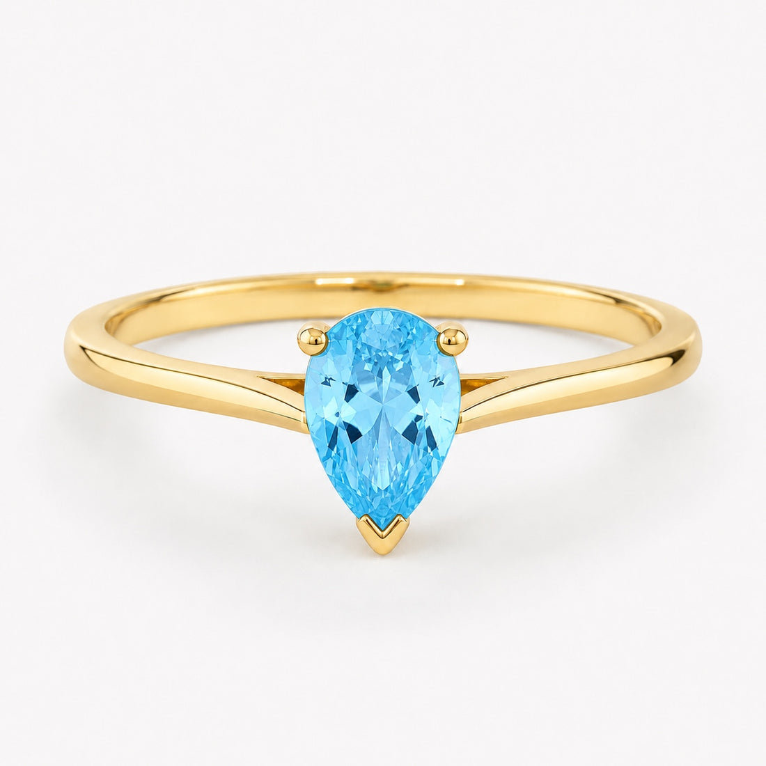 0.50 carat pear-cut blue topaz solitaire ring in 14K yellow gold
