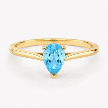 0.50 carat pear-cut blue topaz solitaire ring in 14K yellow gold
