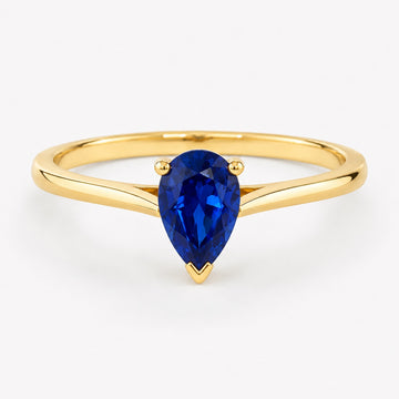 0.50 carat pear-cut laboratory-created blue sapphire solitaire ring in 14K yellow gold
