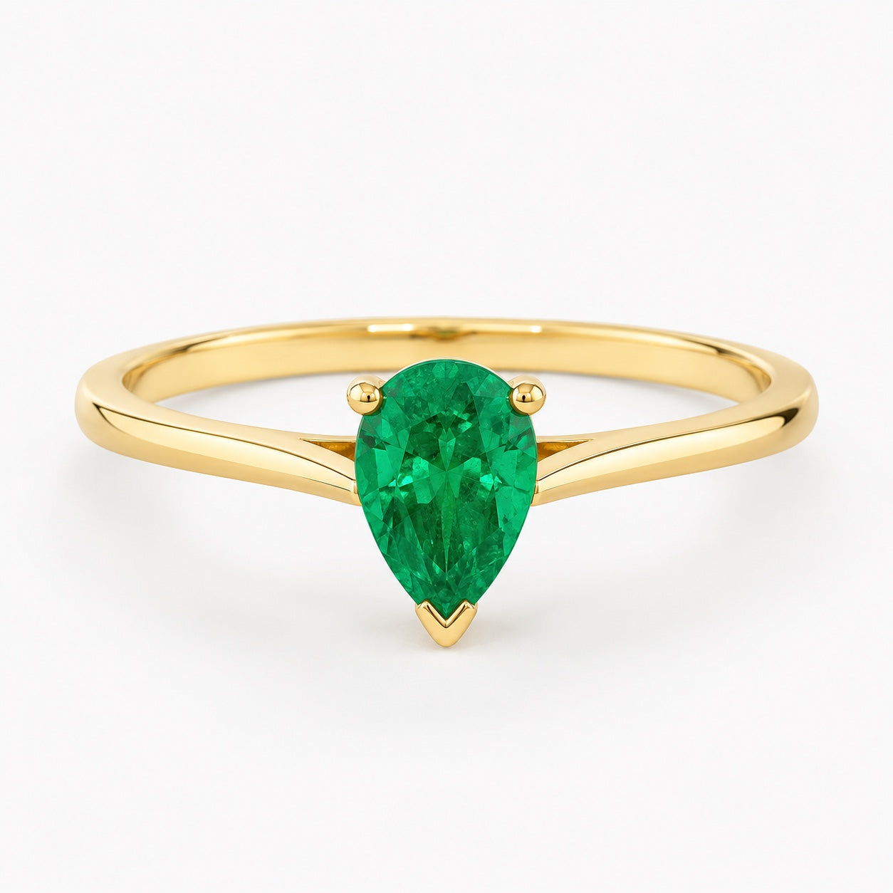 0.50 carat pear-cut laboratory-created emerald solitaire ring in 14K yellow gold
