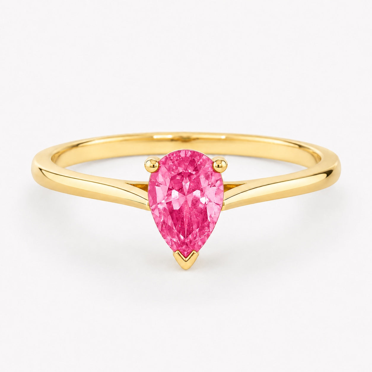 0.50 carat pear-cut laboratory-created pink sapphire solitaire ring in 14K yellow gold