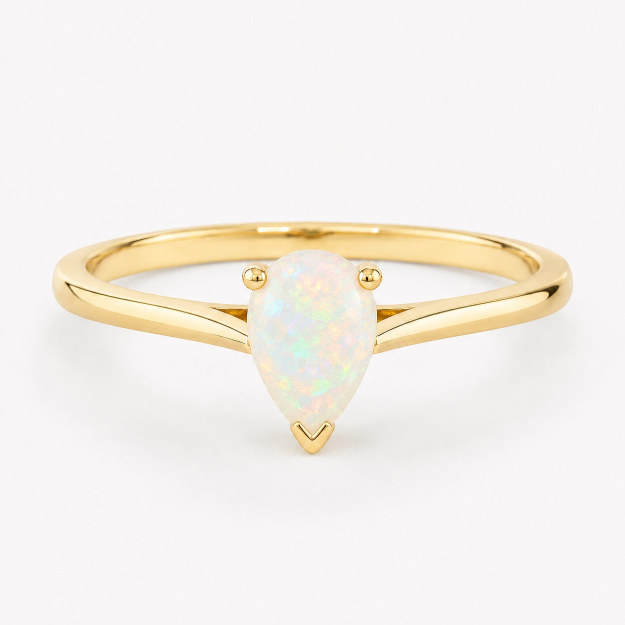 0.50 carat pear-shaped natural white opal solitaire ring in 14K yellow gold