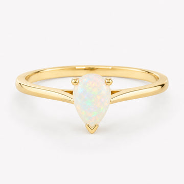 0.50 carat pear-shaped natural white opal solitaire ring in 14K yellow gold