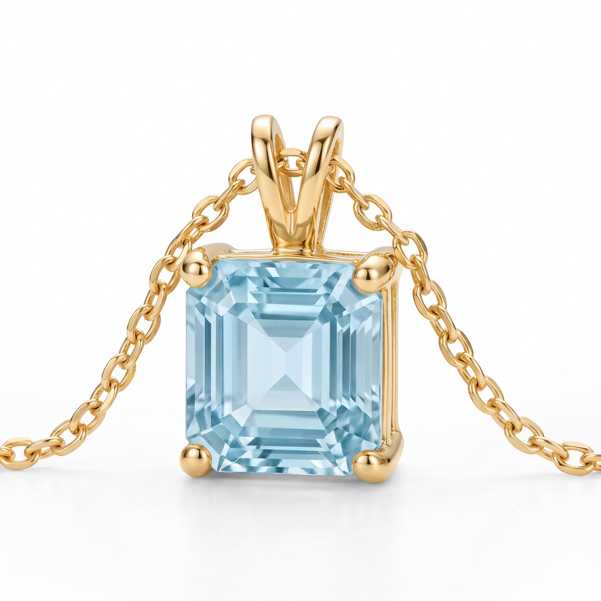 Asscher-Cut Aquamarine Solitaire Necklace in Solid Gold macro gemstone and setting view on white background