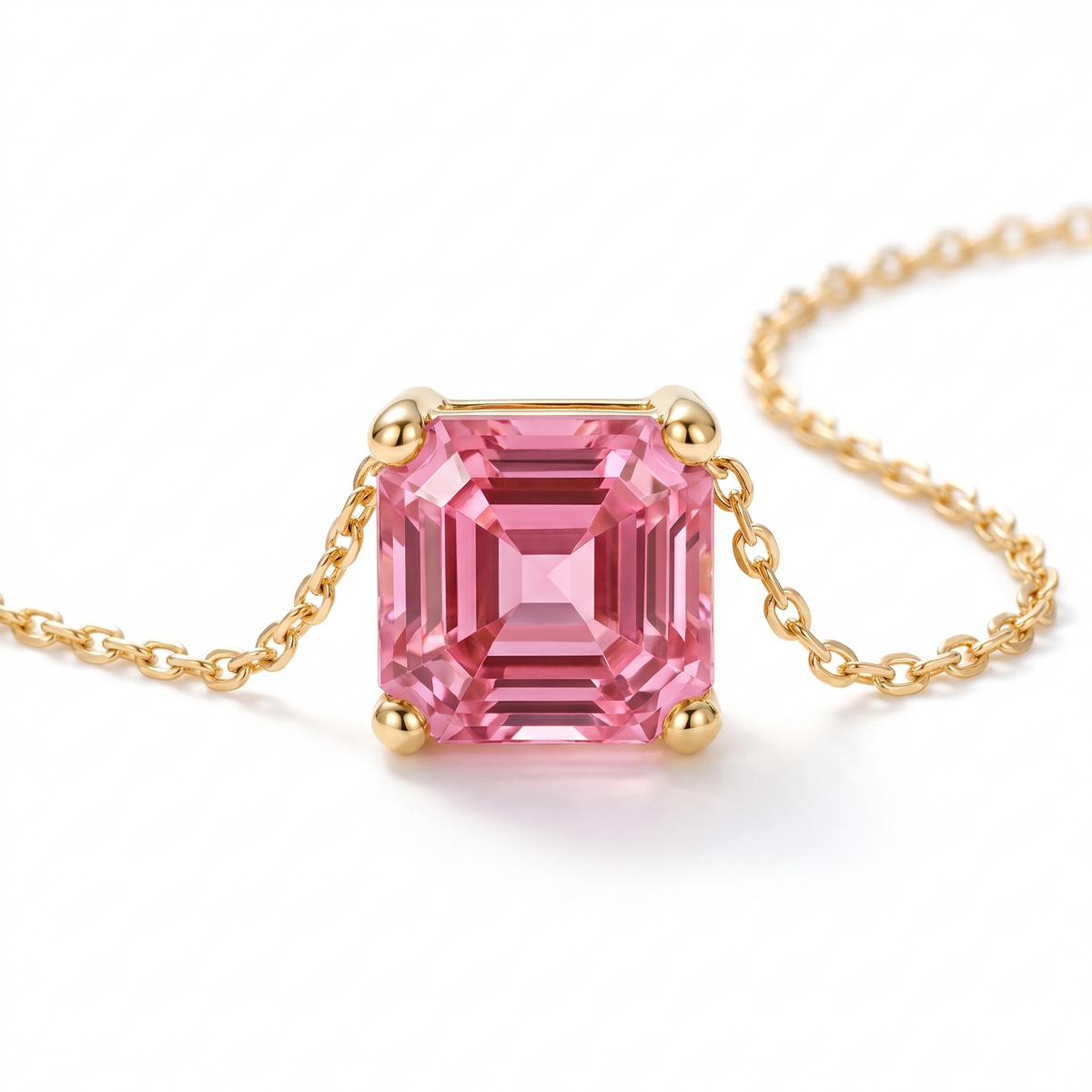 Asscher-Cut Pink Tourmaline Solitaire Necklace in Solid Gold macro gemstone and setting view on white background