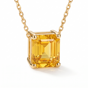 Asscher-Cut Yellow Sapphire Solitaire Necklace in Solid Gold macro gemstone and setting view on white background