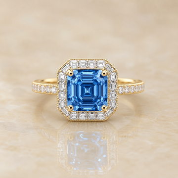 Blue Asscher-cut lab-grown diamond Art Deco halo engagement ring in 14K yellow gold