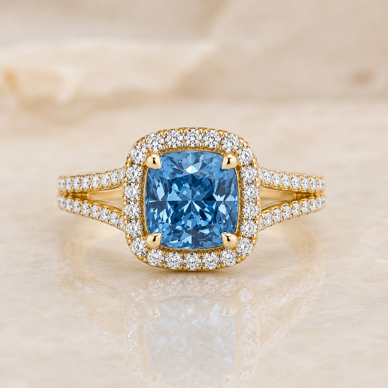 Blue cushion lab-grown diamond split-shank halo engagement ring in 14K yellow gold