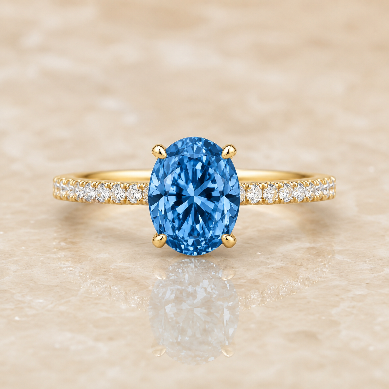 Blue oval lab-grown diamond pavé engagement ring in 14K yellow gold