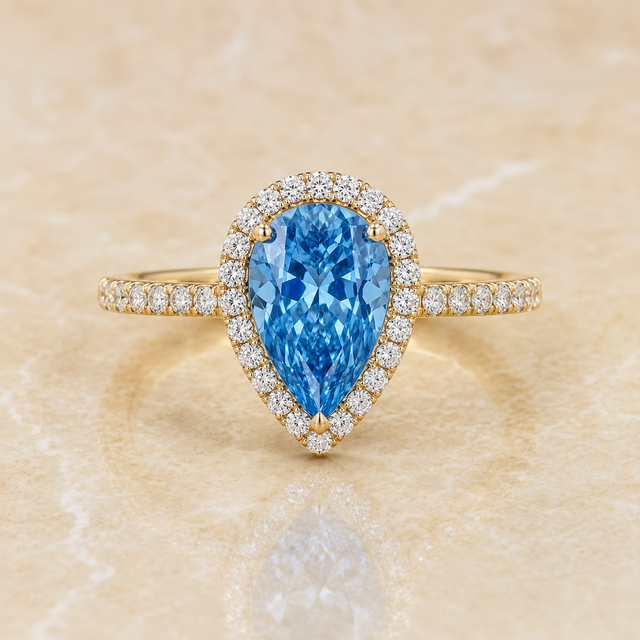 Blue pear-shaped lab-grown diamond halo engagement ring in 14K yellow gold