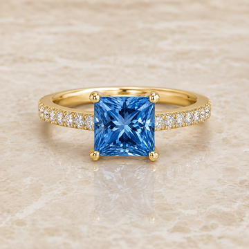 Blue princess-cut lab-grown diamond channel-set engagement ring in 14K yellow gold