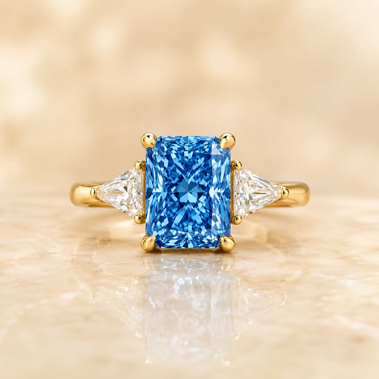 Blue radiant-cut lab-grown diamond three-stone engagement ring in 14K yellow gold