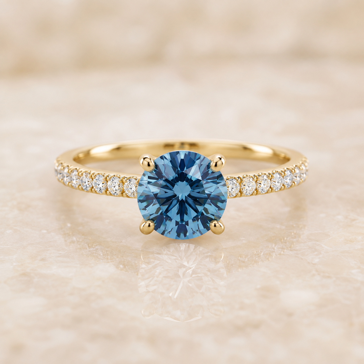 Blue round lab-grown diamond pavé engagement ring in 14K yellow gold