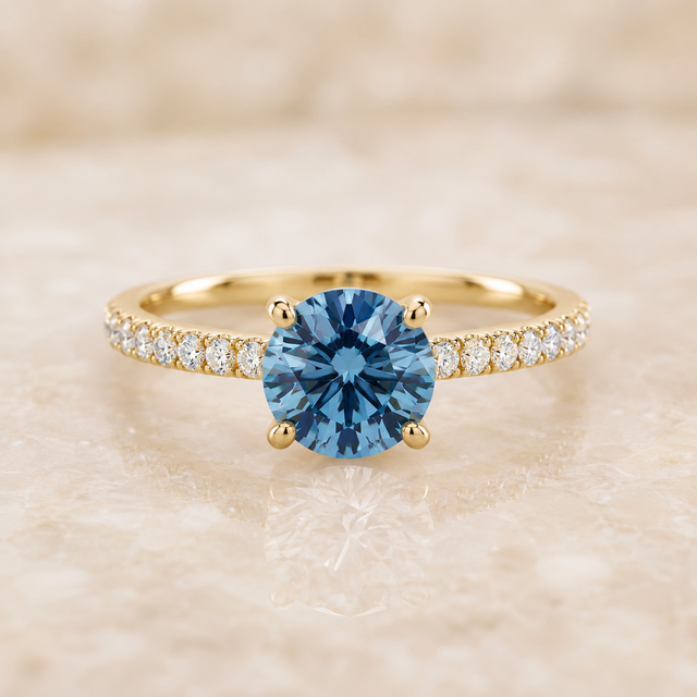 Blue round lab-grown diamond pavé engagement ring in 14K yellow gold