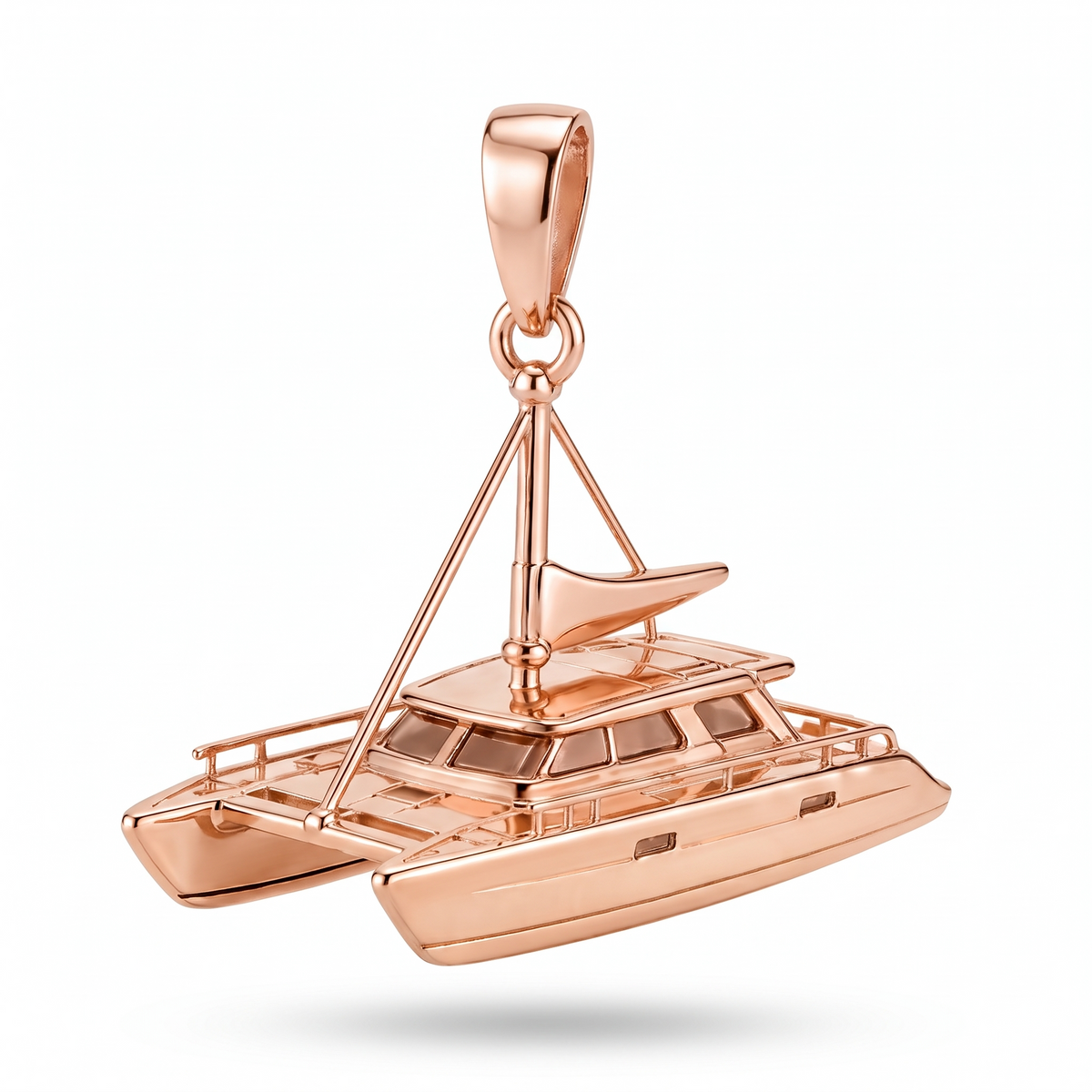 Solid Gold Catamaran Pendant shown in rose-gold color variation on white background