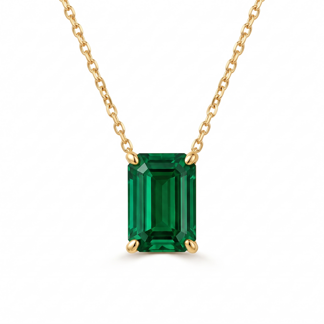 Emerald-cut emerald solitaire necklace in solid gold, catalog view — AI-generated design representation