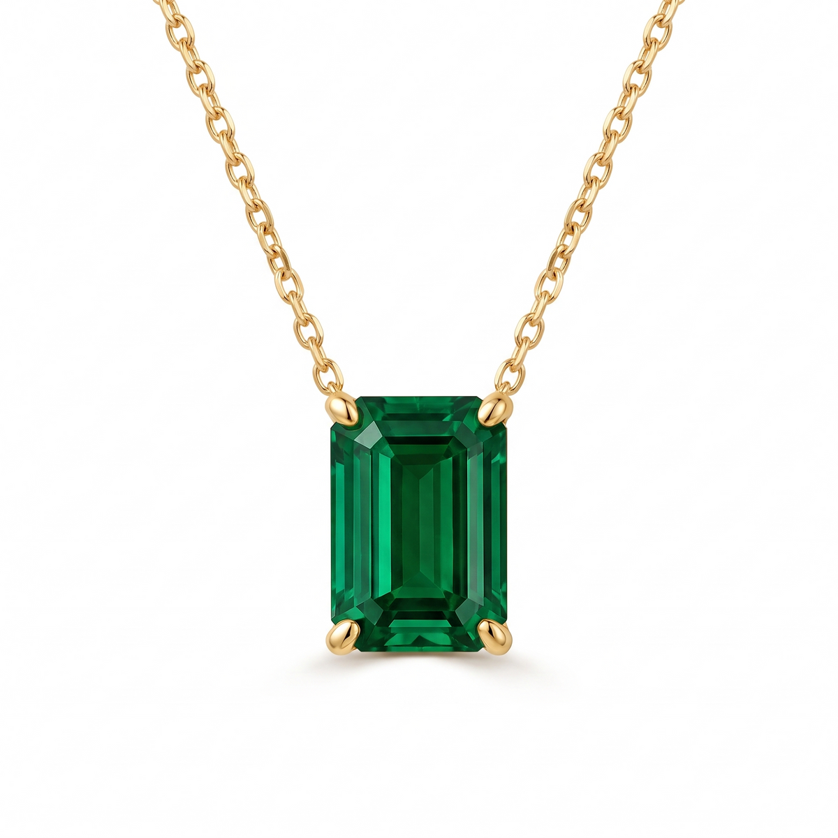 Emerald-cut emerald solitaire necklace in solid gold, catalog view — AI-generated design representation