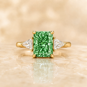Green radiant-cut lab-grown diamond three-stone engagement ring in 14K yellow gold