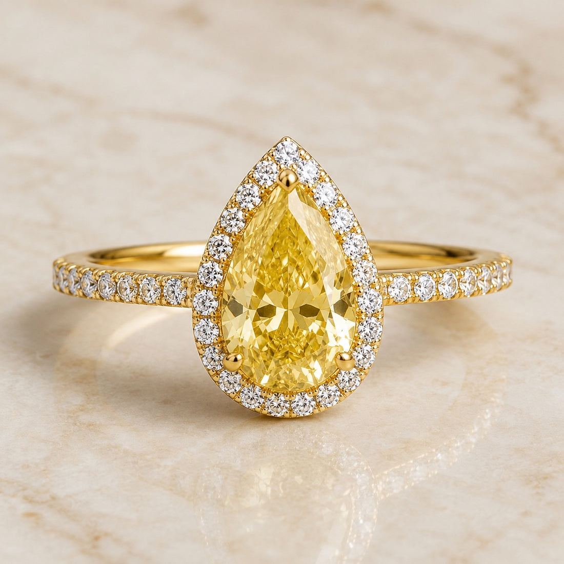 Lumière pear yellow lab-grown diamond halo engagement ring in yellow gold