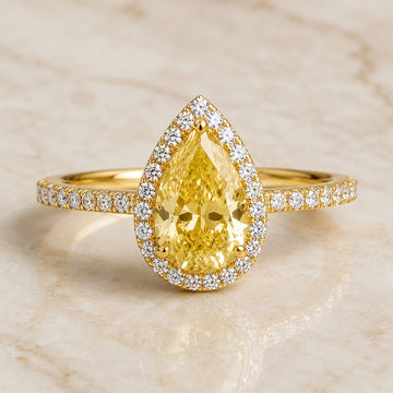 Lumière pear yellow lab-grown diamond halo engagement ring in yellow gold