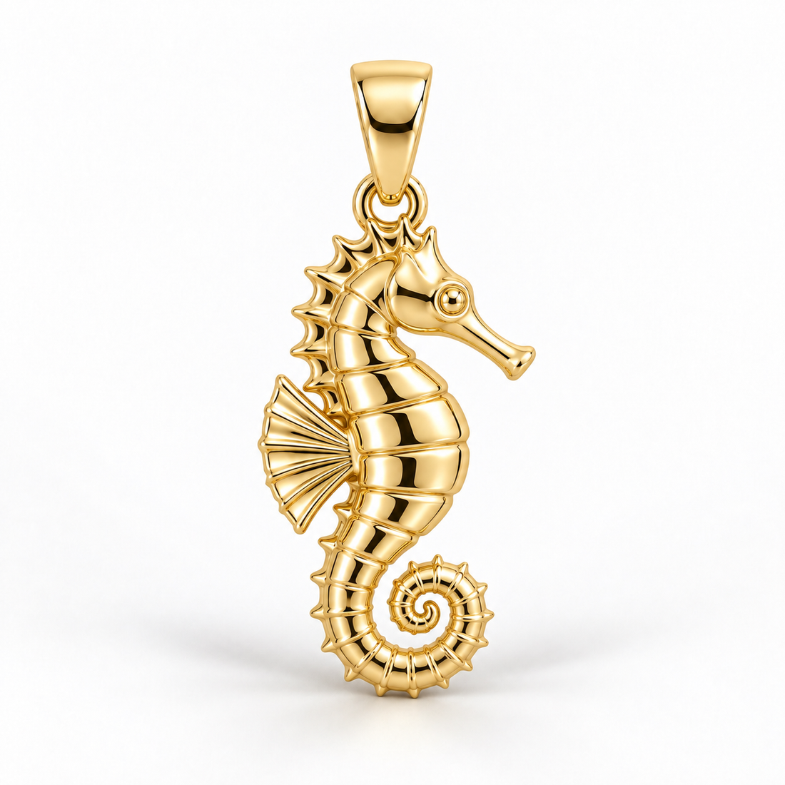 Yellow-gold seahorse pendant design rendering with ridged body, fan-shaped fin and curled tail on white.