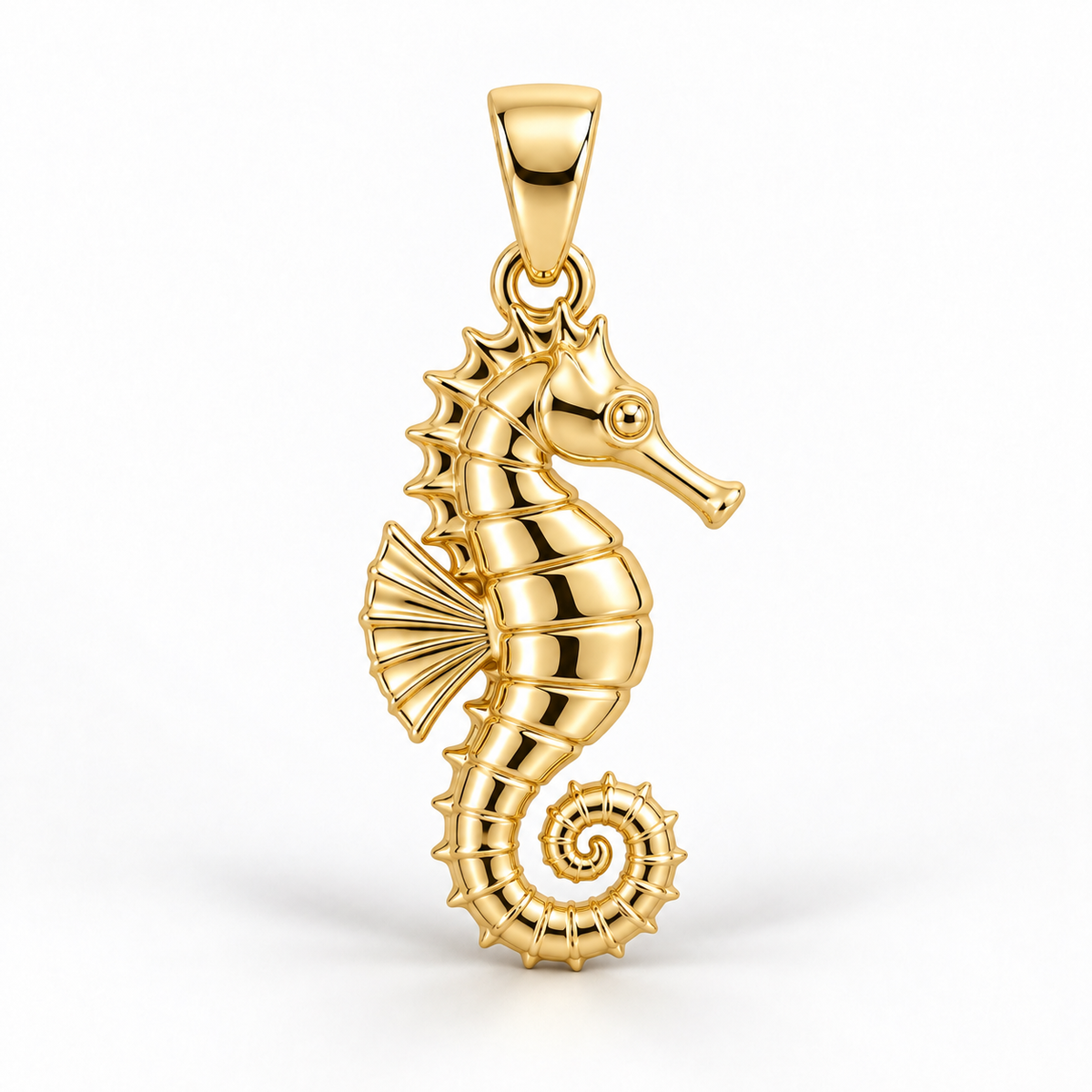 Yellow-gold seahorse pendant design rendering with ridged body, fan-shaped fin and curled tail on white.