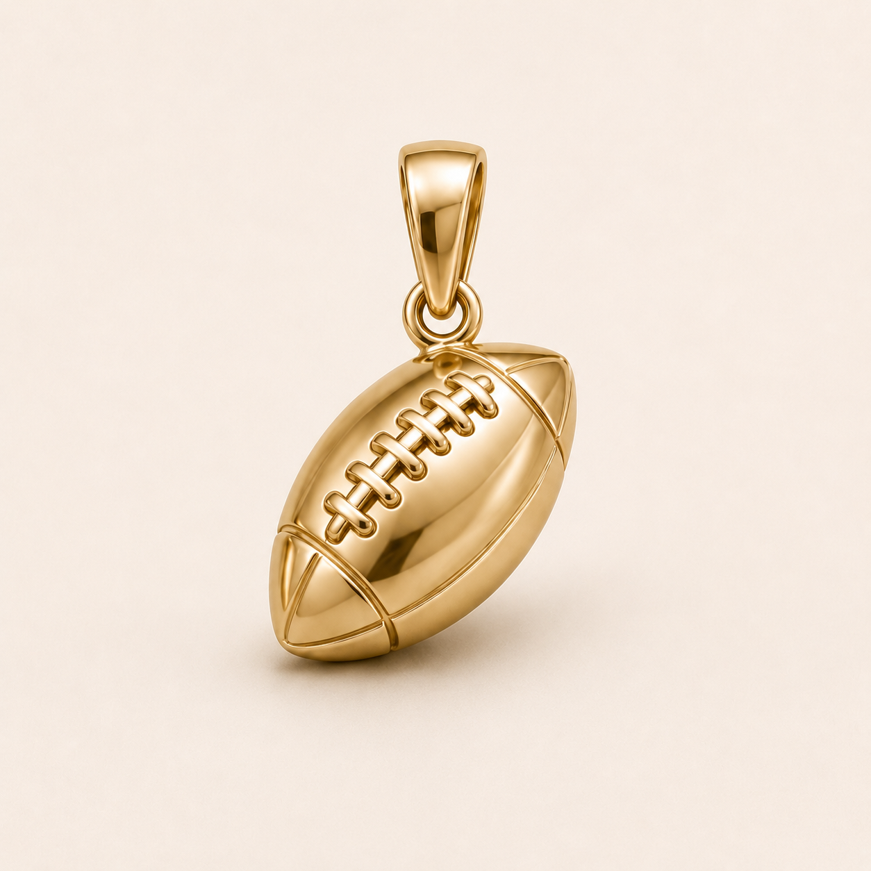 Mini Football Pendant in yellow gold — 1Luxury Miami design rendering