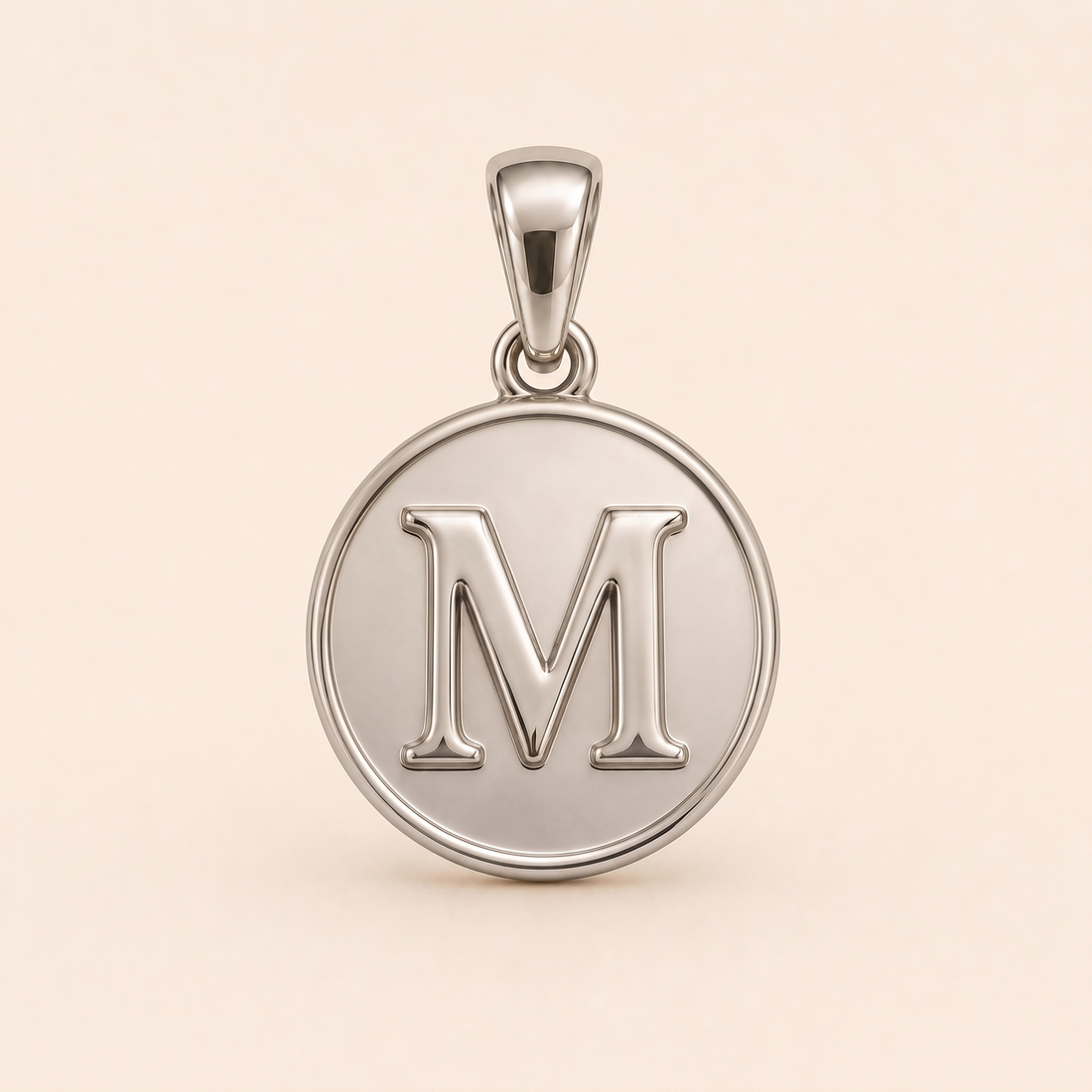 Mini Initial M Medallion pendant — reused white-gold design rendering for the silver counterpart.