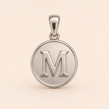 Mini Initial M Medallion pendant — reused white-gold design rendering for the silver counterpart.