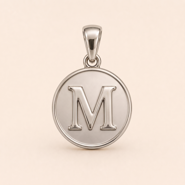 Mini Initial M Medallion pendant — reused white-gold design rendering for the silver counterpart.