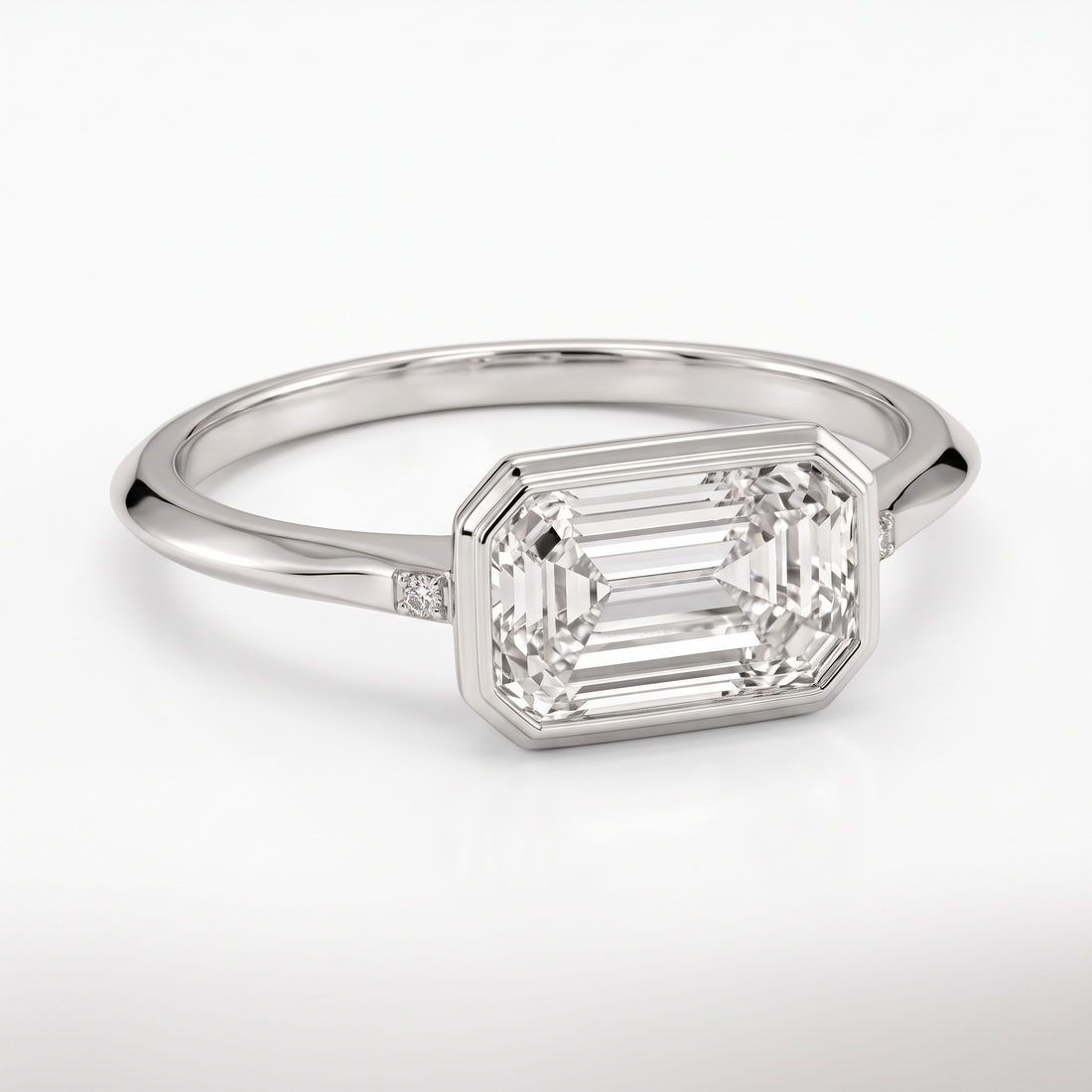 Model 16 Emerald Bezel Minimal engagement ring three-quarter catalog view on white background