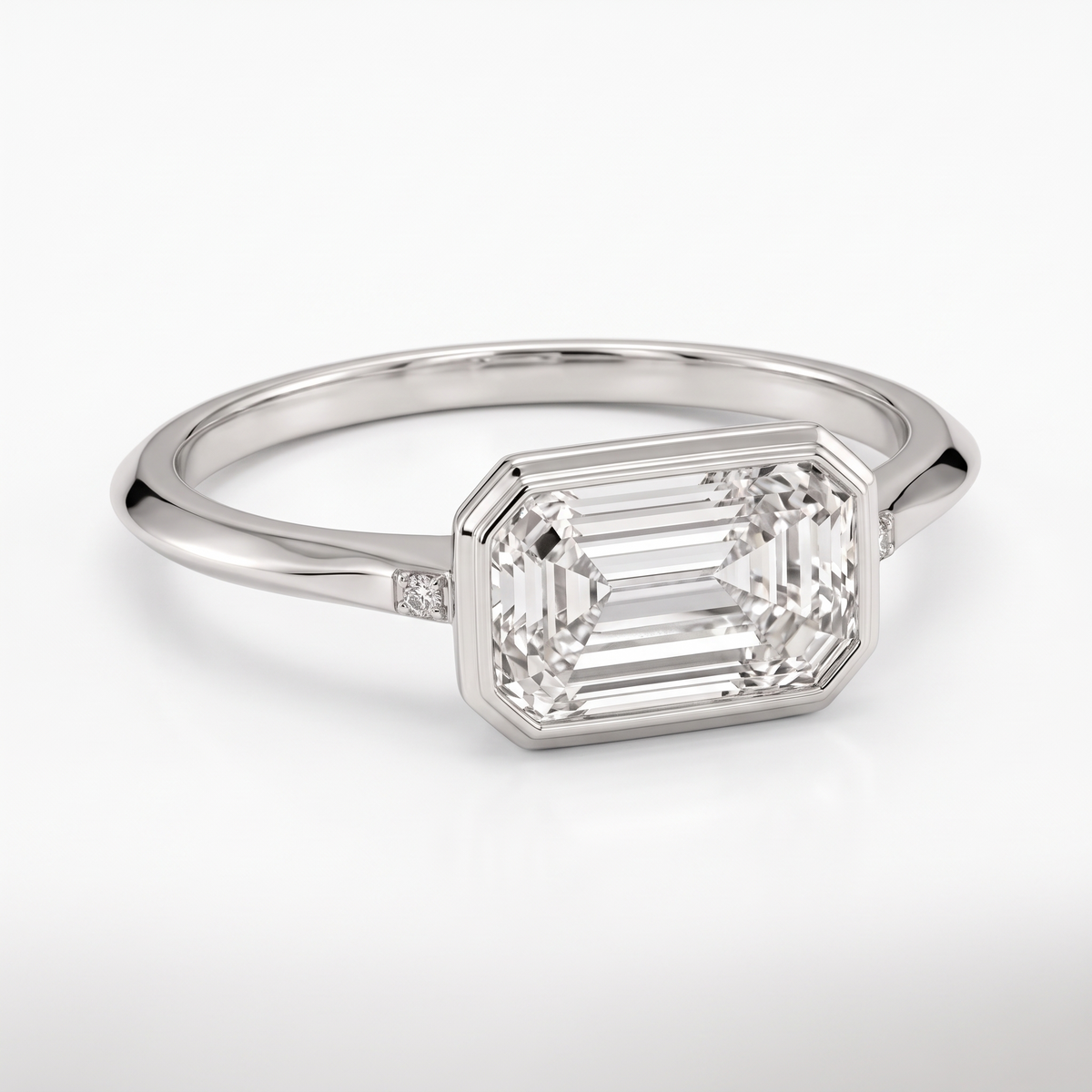 Model 16 Emerald Bezel Minimal engagement ring three-quarter catalog view on white background