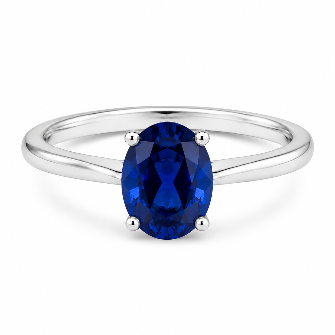 Oval simulated blue sapphire solitaire ring in polished 925 sterling silver