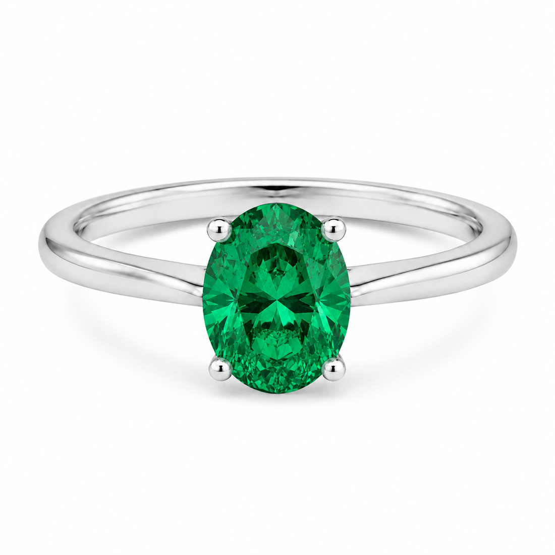Oval simulated emerald solitaire ring in polished 925 sterling silver