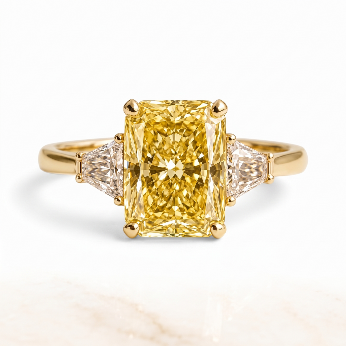 Radiance yellow radiant-cut lab-grown diamond three-stone engagement ring catalog hero on white background