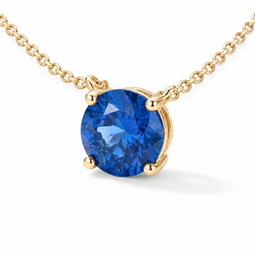 Round-Cut Blue Sapphire Solitaire Necklace in Solid Gold, main image — AI-generated design representation