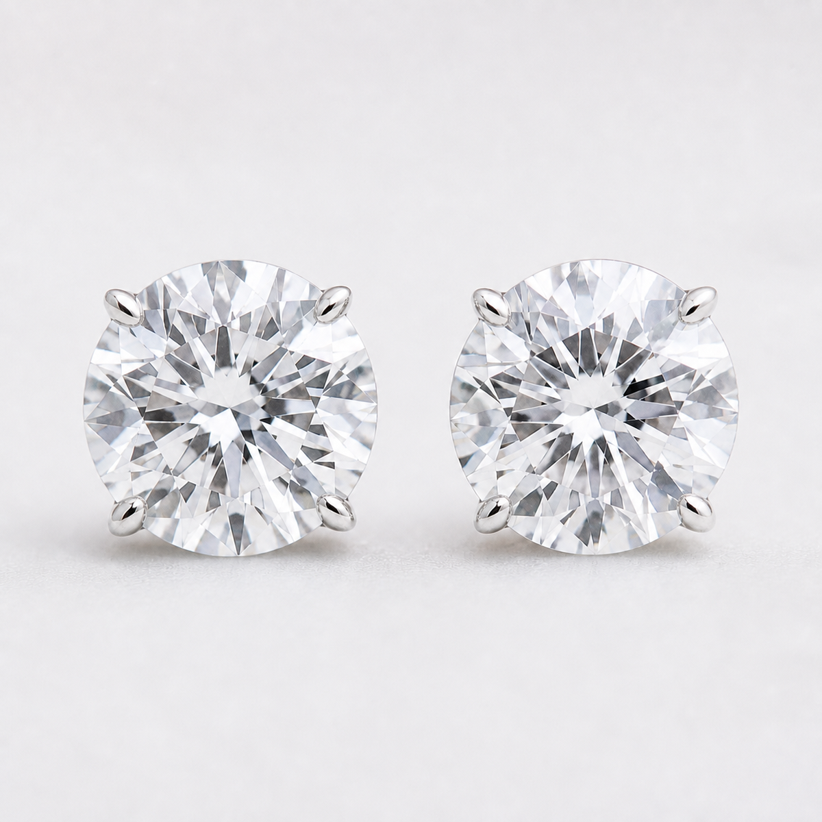 Close-up of 0.90 CTW lab-grown diamond stud earrings in 14K white gold