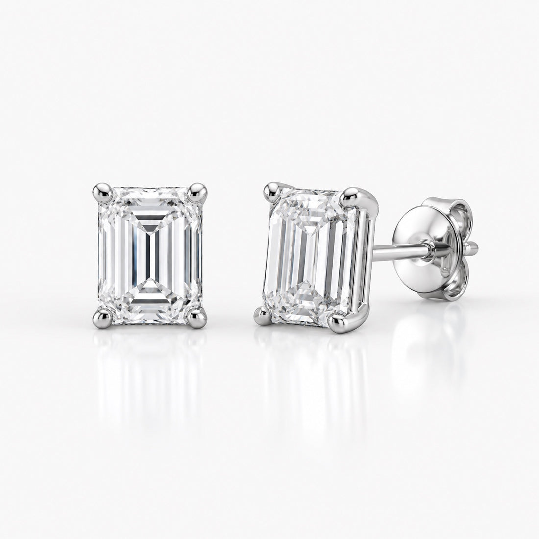 Emerald-cut 1.00 CTW lab-grown diamond stud earrings in 14K white gold, front and side views
