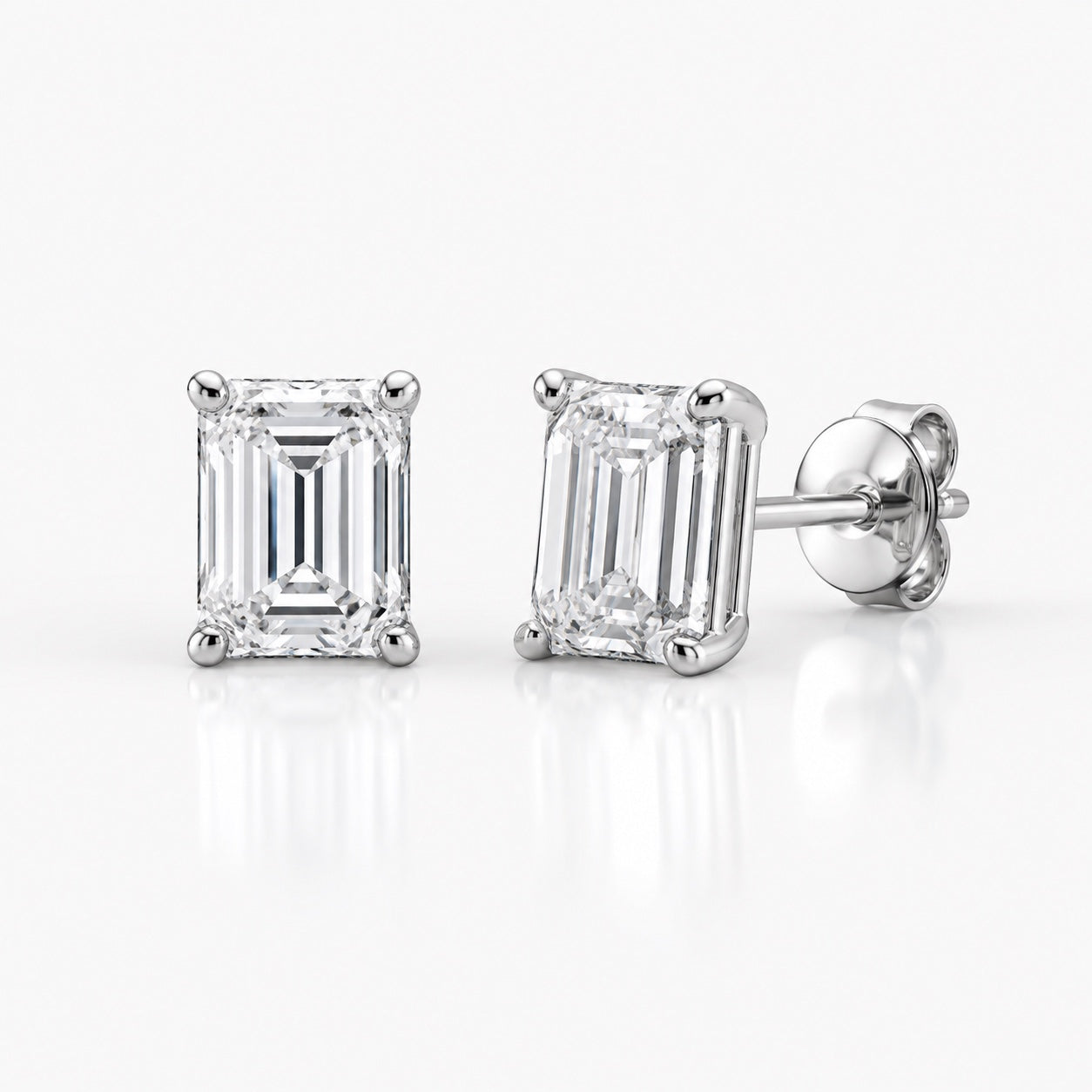 Emerald-cut 1.00 CTW lab-grown diamond stud earrings in 14K white gold, front and side views